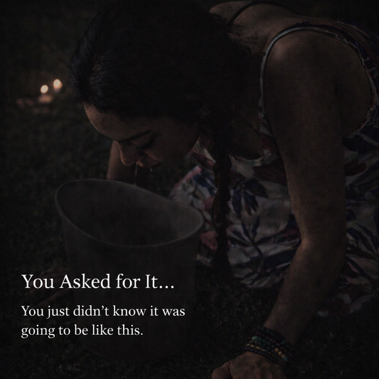 Woman in a dimly lit outdoor ceremony leaning over a bucket during an intense Kambo experience, capturing a raw moment of physical and emotional release with the text “You Asked for It… You just didn’t know it was going to be like this.”